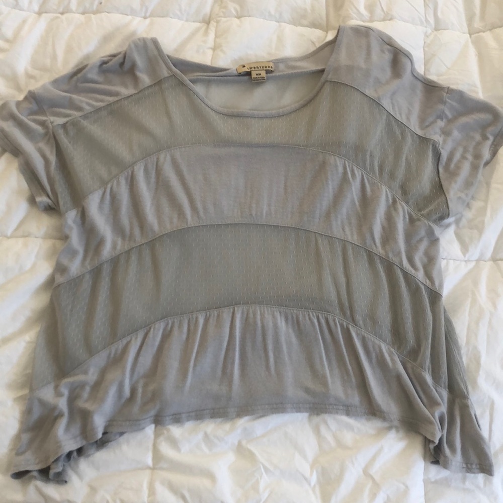 Cotton short-sleeved, partly-sheer, shirt.